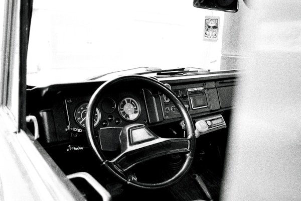 a black and white photo of a car dashboard